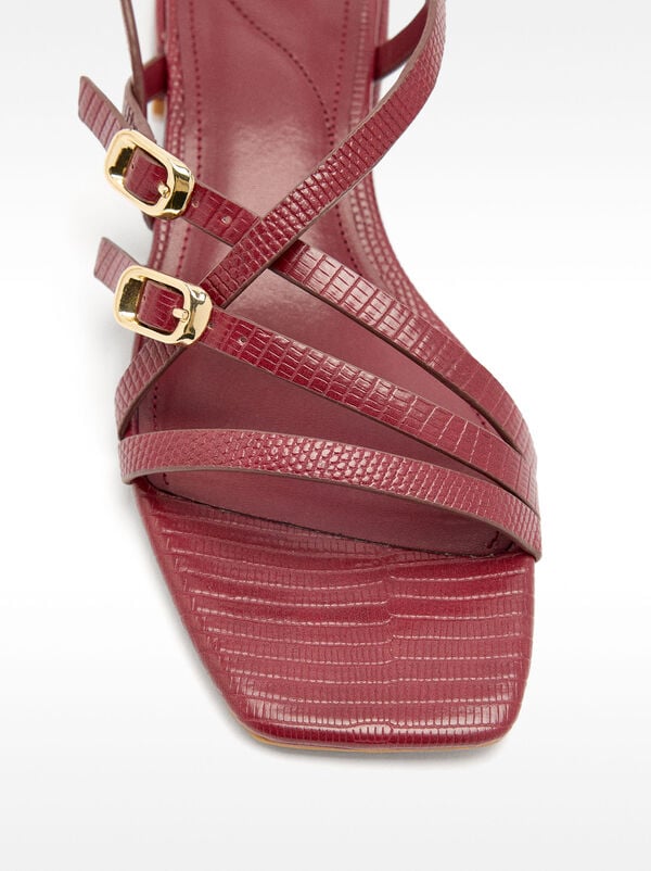 Sandals with animal-embossed straps