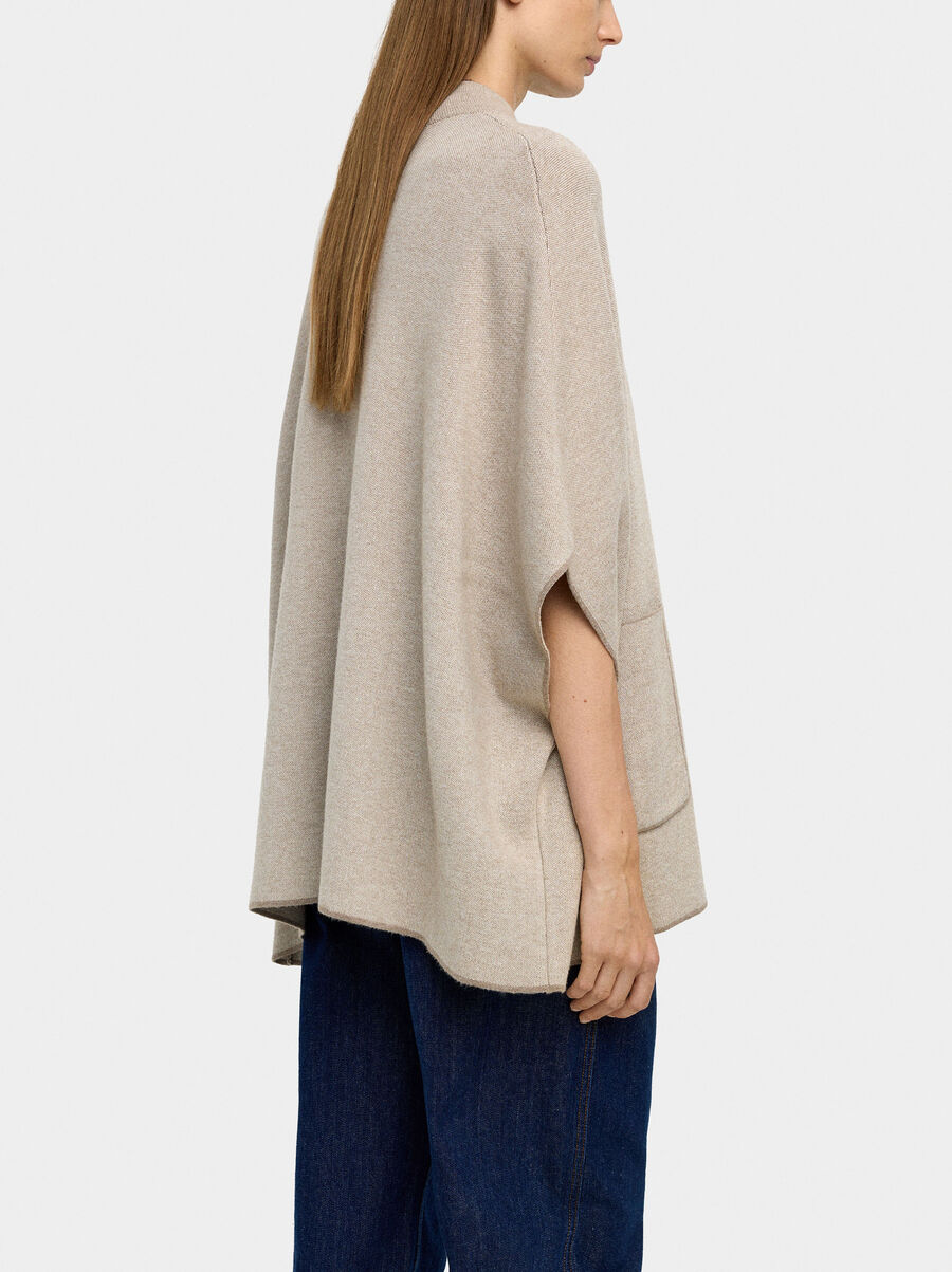 Knitted poncho with stitching detail