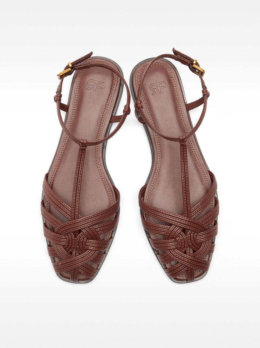 Flat sandals with braided straps