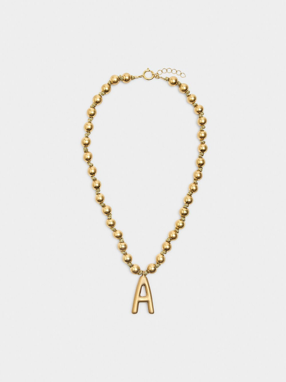 Short necklace with gold beads