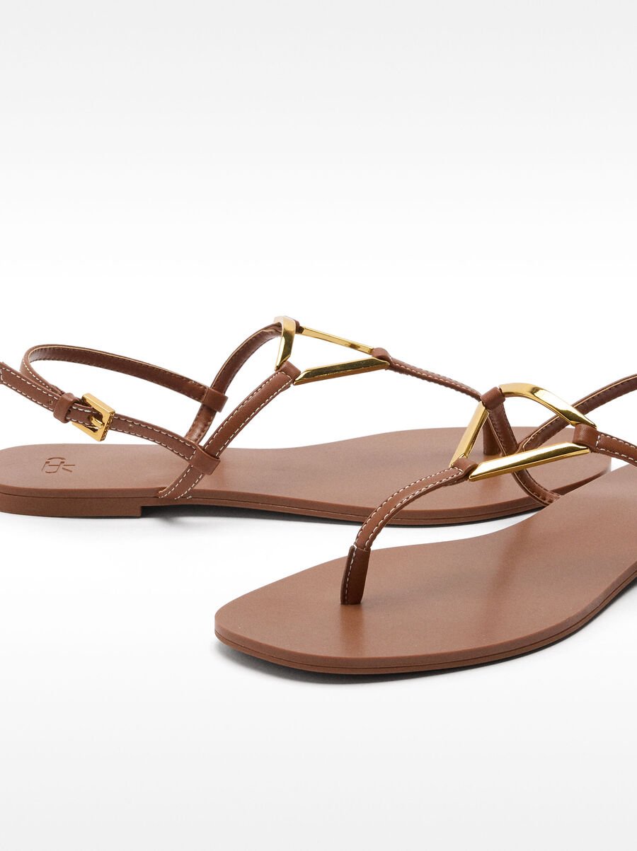Flat sandals with metallic detail straps