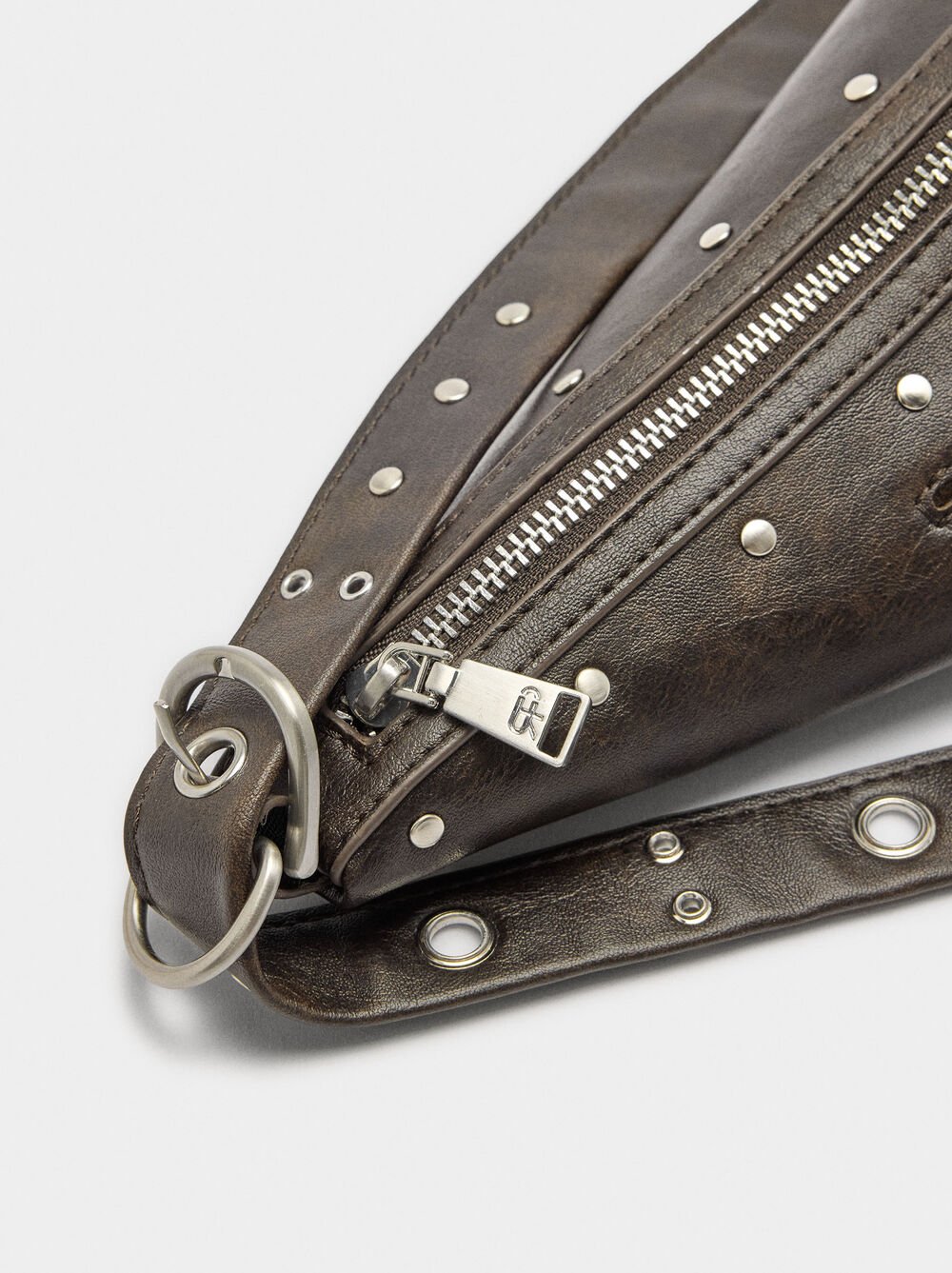 Asymmetric shoulder bag with studs