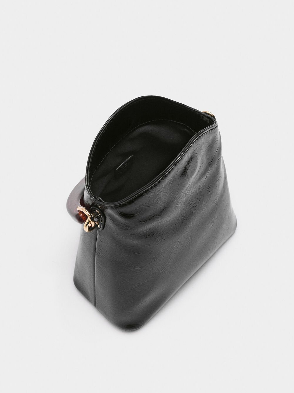 Handbag with tortoiseshell-effect handle