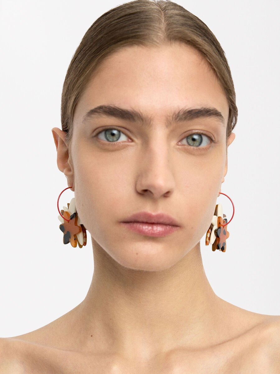 Open hoop earrings with flowers