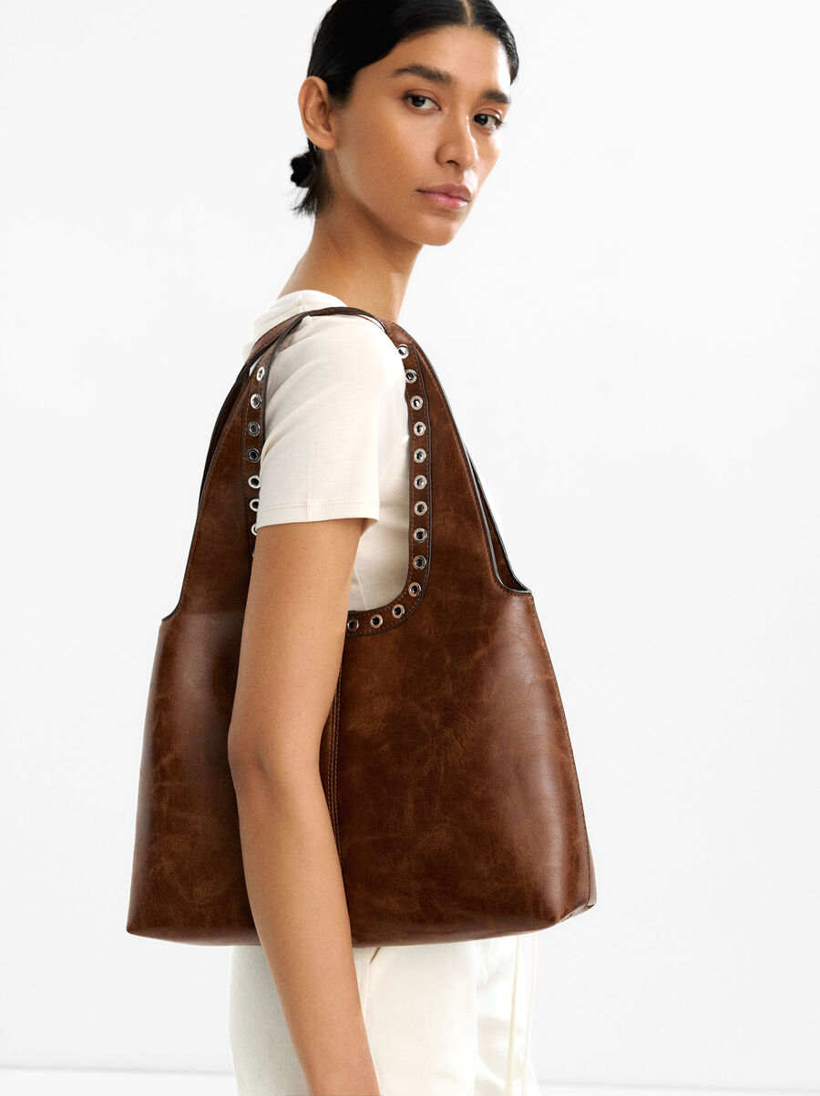 Crackled shoulder bag with studs