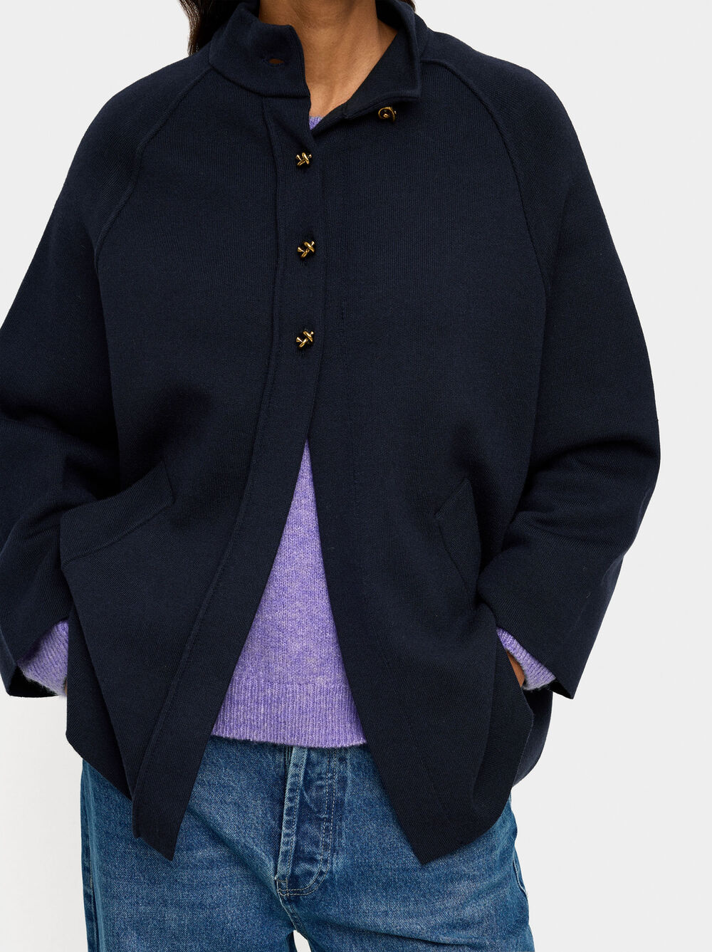 Poncho de malha com gola alta