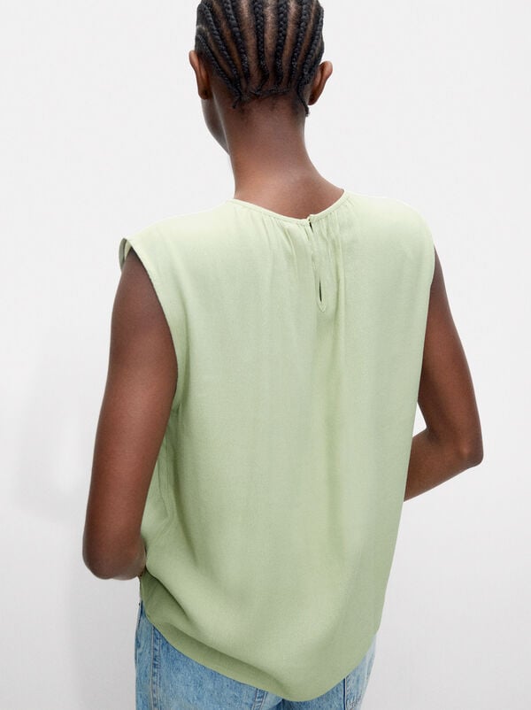 Top with sleeveless design