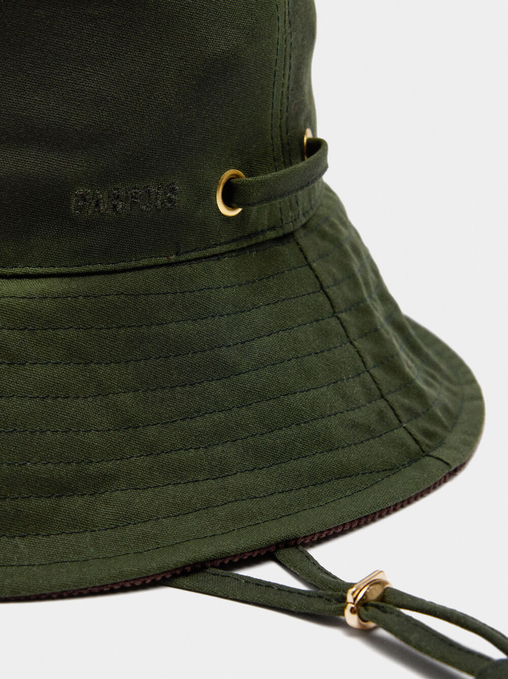 Bucket hat with adjustable strap