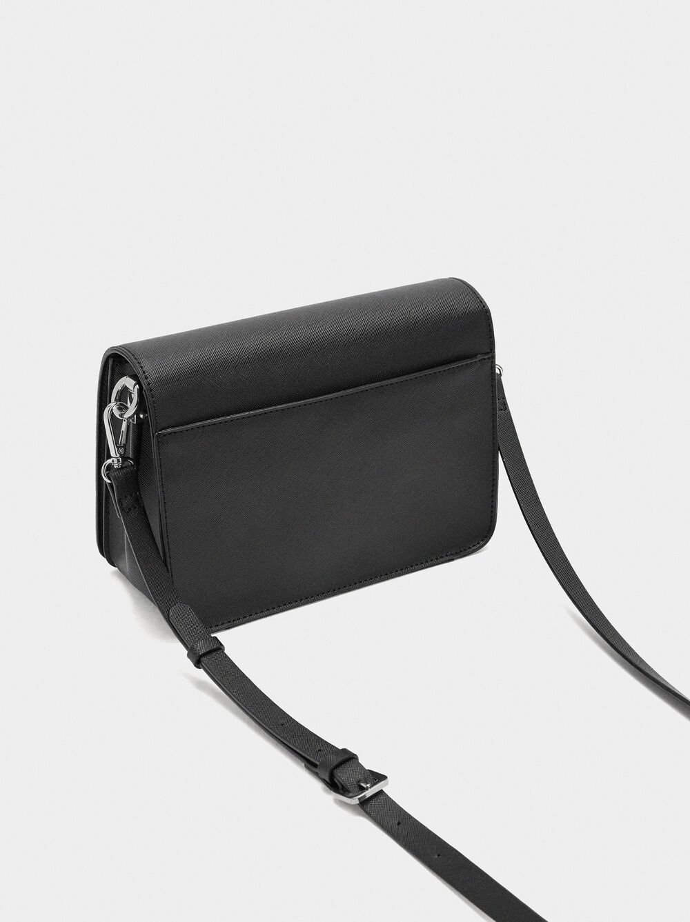 Crossbody bag with texture and flap closure