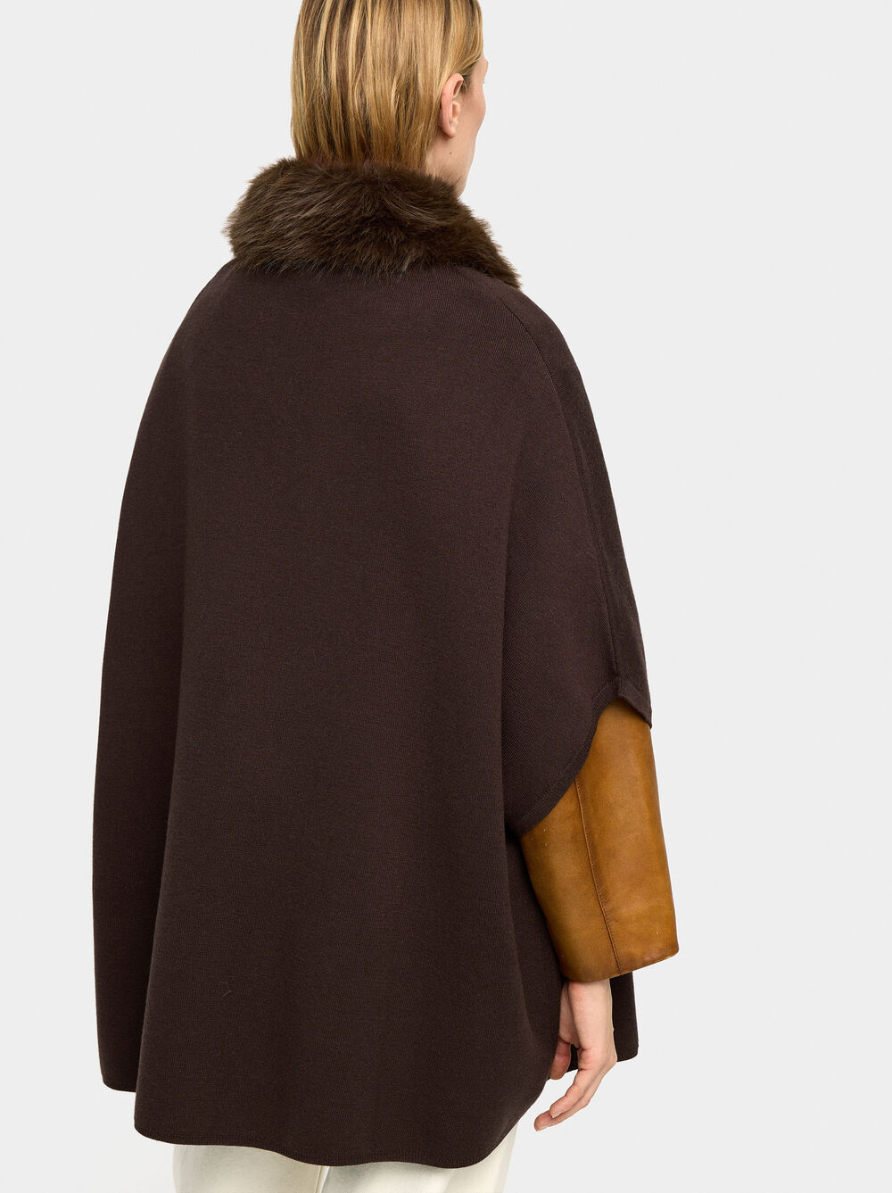 Knit poncho with fur-effect collar
