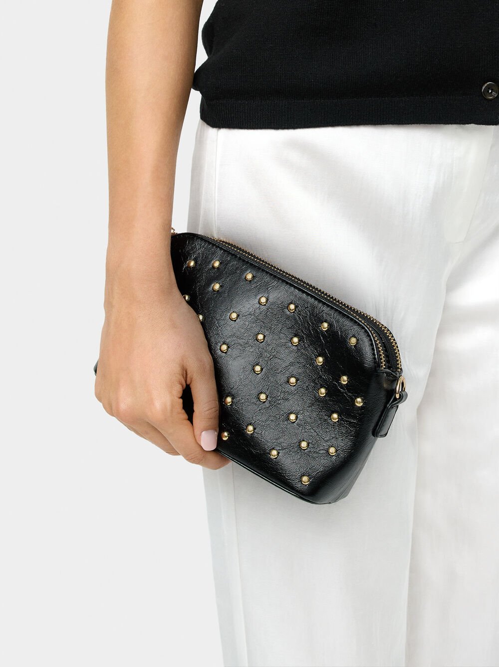 Bossa bandolera de amb tatxes