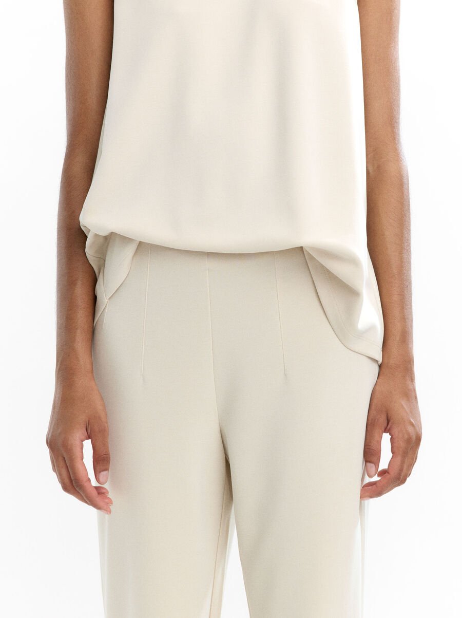 Pleated trousers with elastic waist
