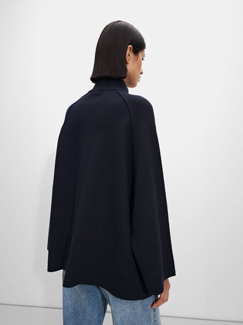 Knit poncho with high neck