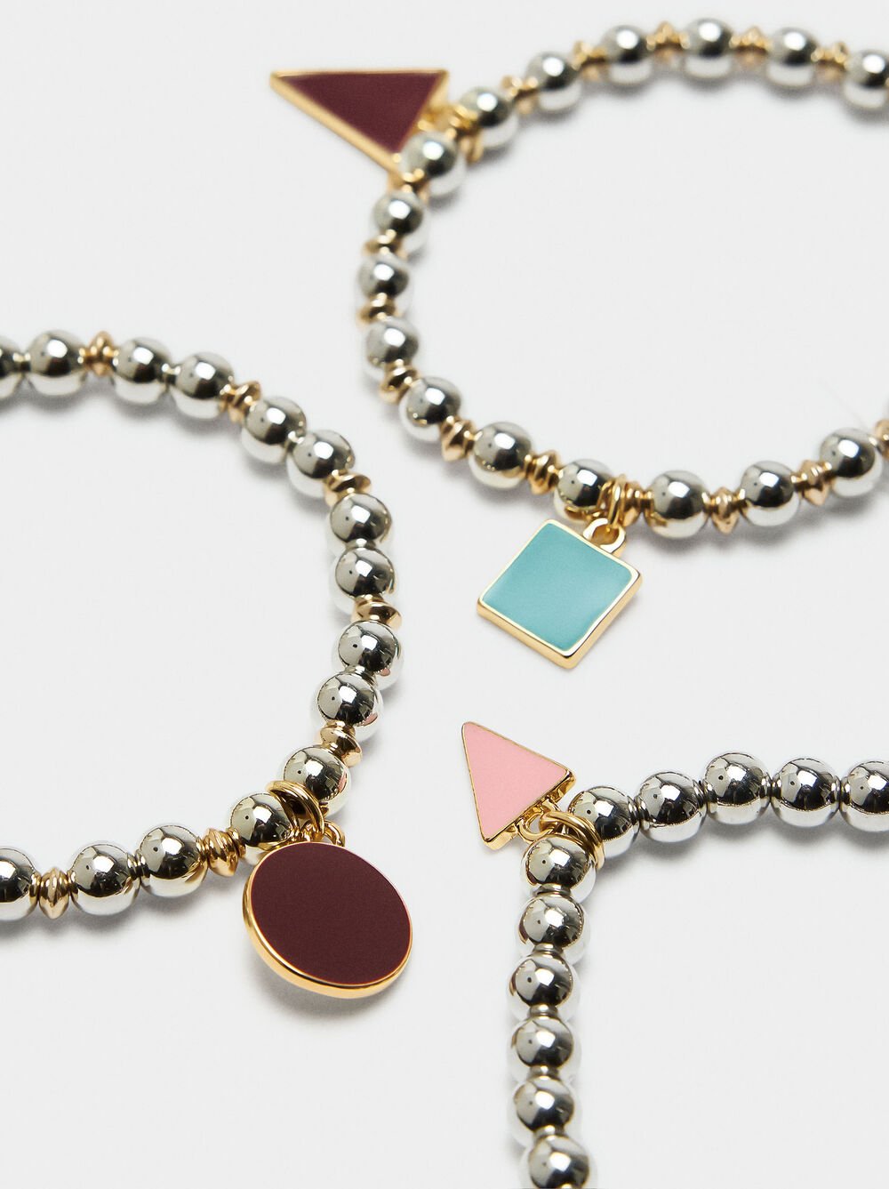 Set of elastic bracelets with charms