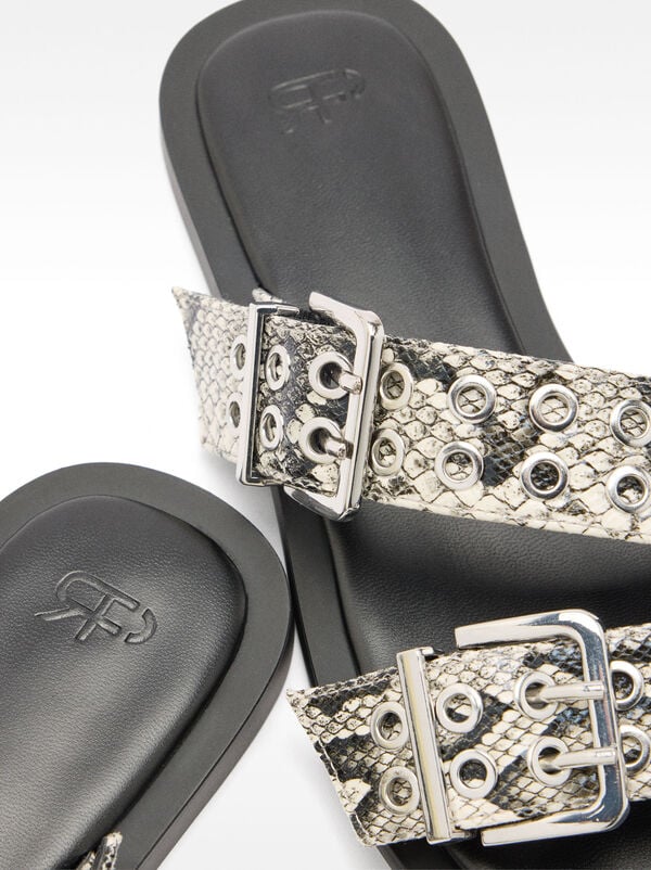 Flat sandals with buckles and studs