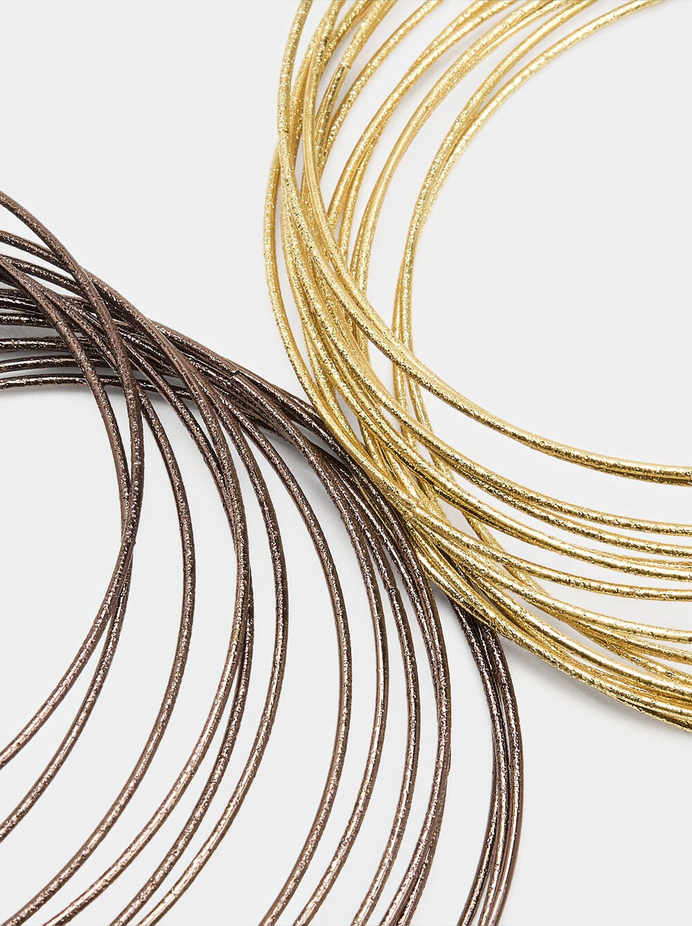 Bracelets rigides entrecroisés