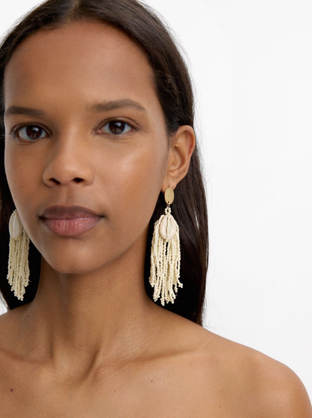 Long beaded earrings with shells