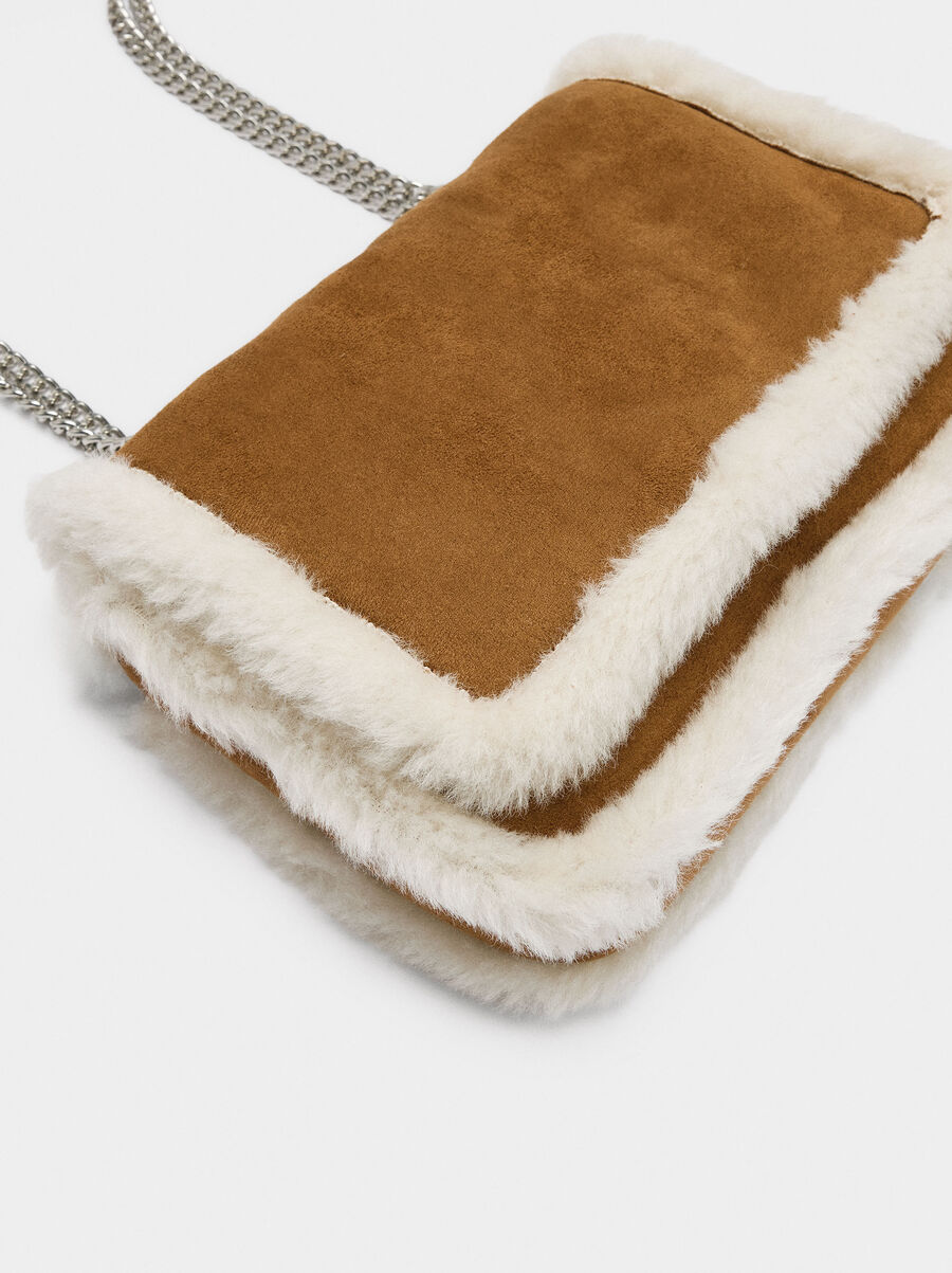 Shoulder bag with fur effect edges
