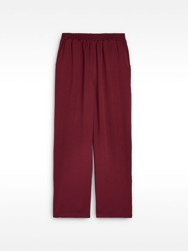 Loose-fitting trousers with elastic waistband