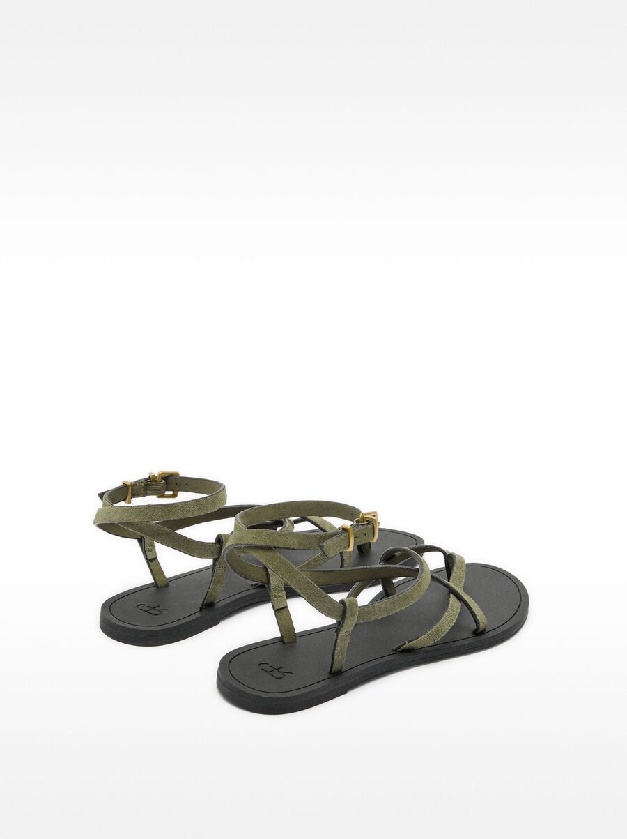 Flat leather sandals with straps