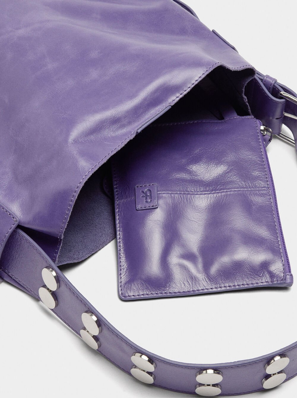 Leather shoulder bag with studs