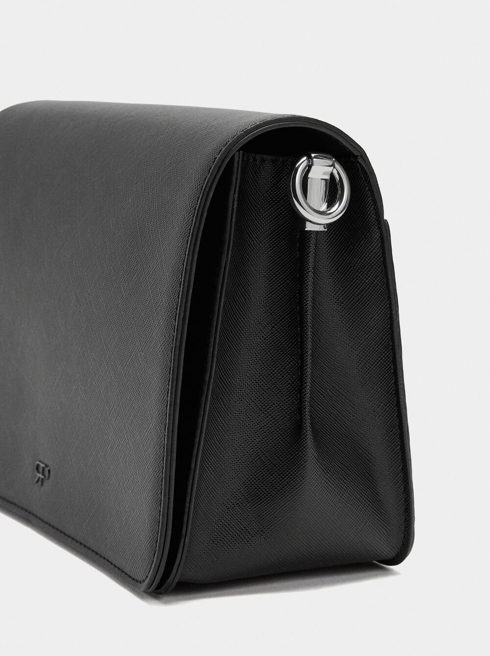 Crossbody bag with texture and flap closure