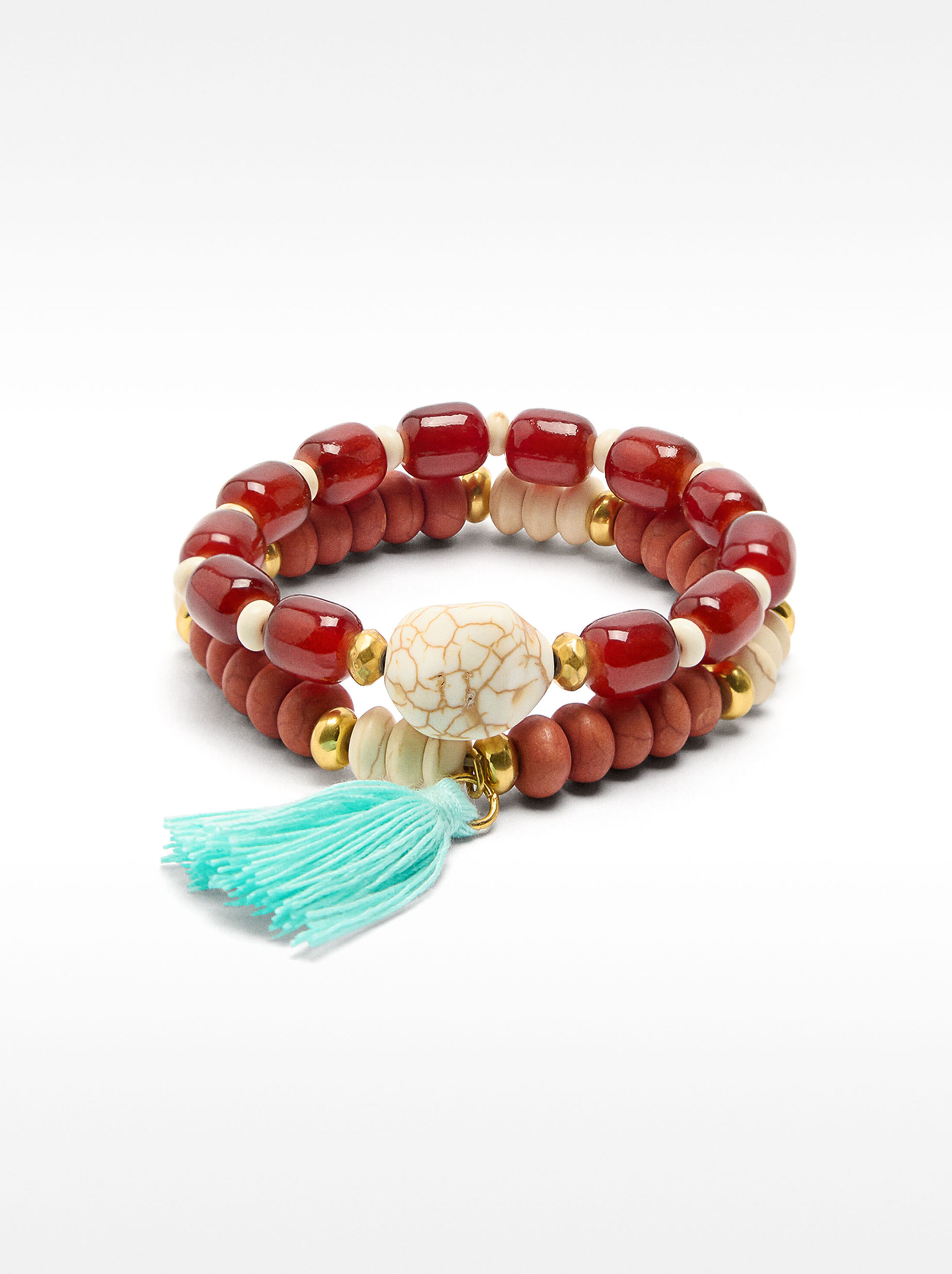 Set of elastic bracelets with tassel image number 0.0