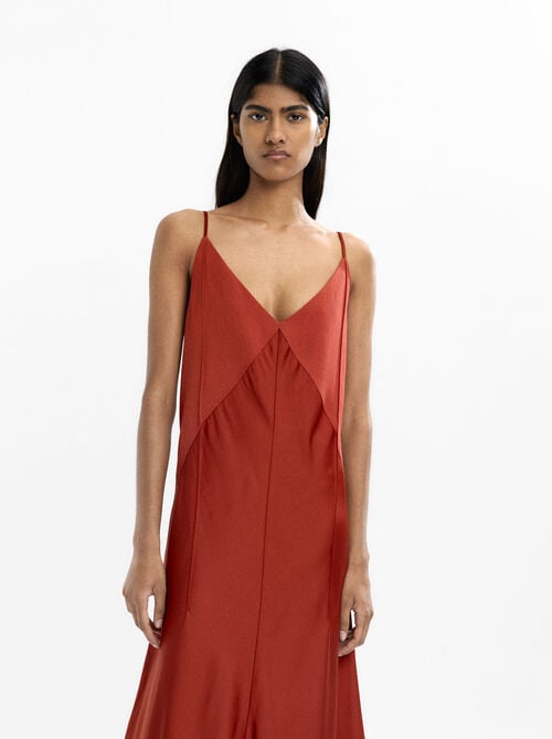 Dress with straps and seams