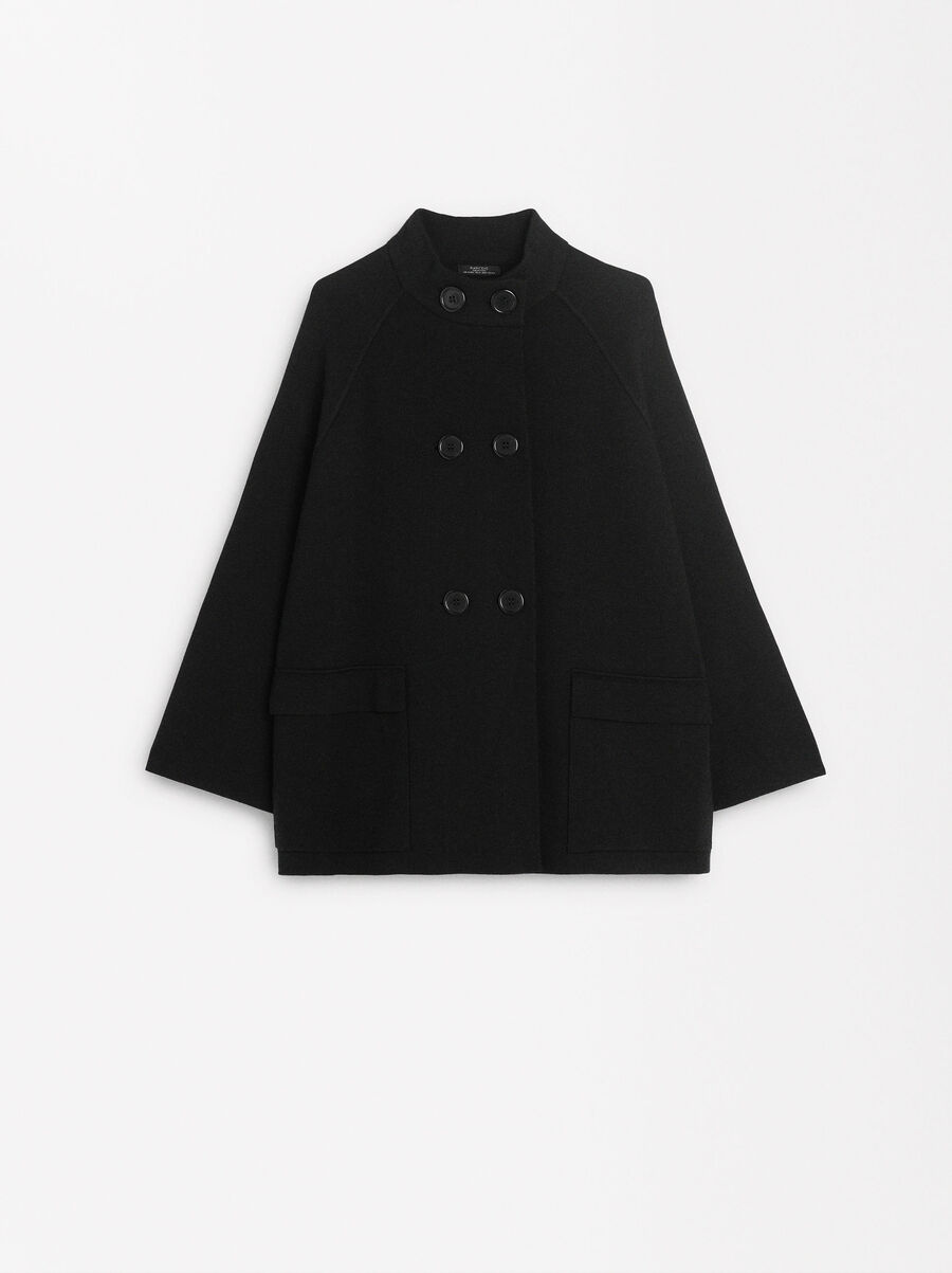 Knitted poncho with buttons