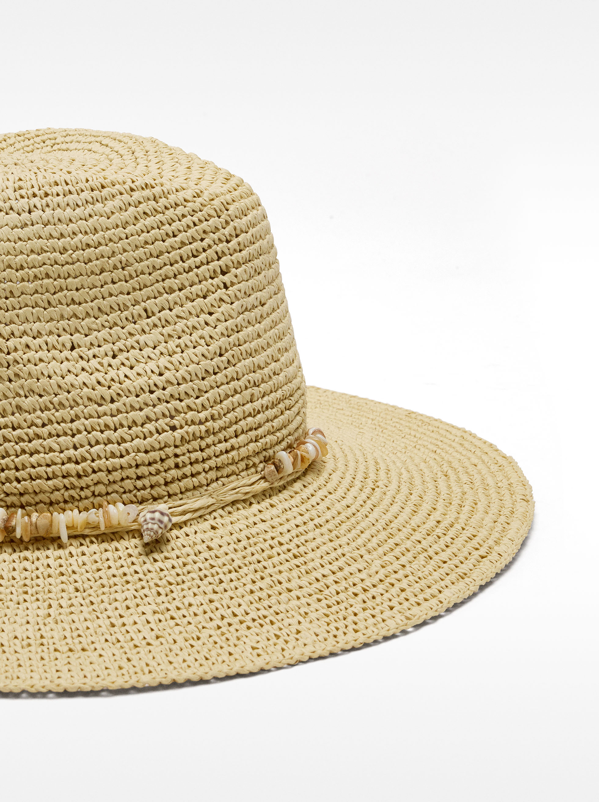 Straw-effect hat with shells and stones image number 1.0