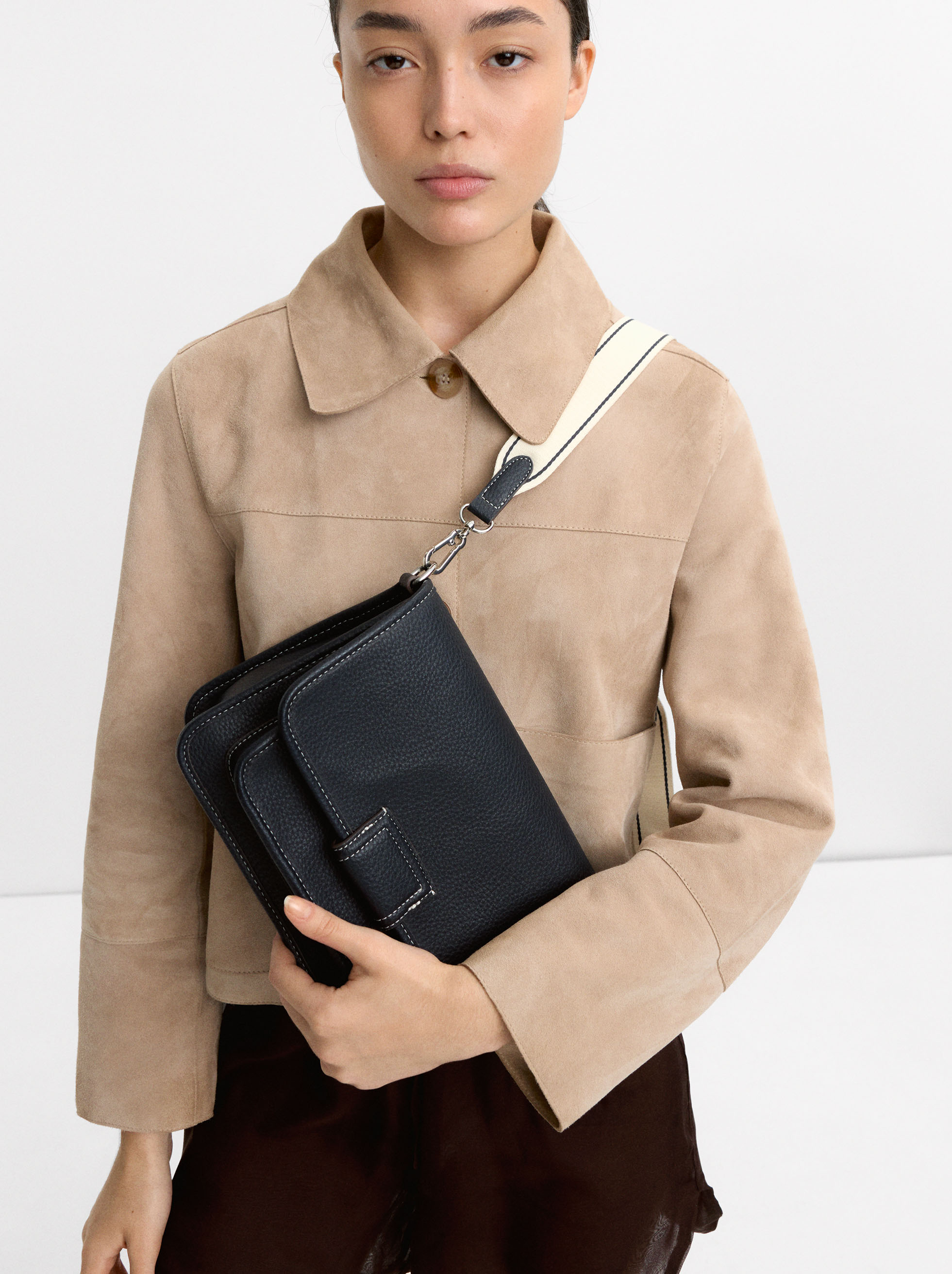 Crossbody bag with texture and flap closure image number 1.0