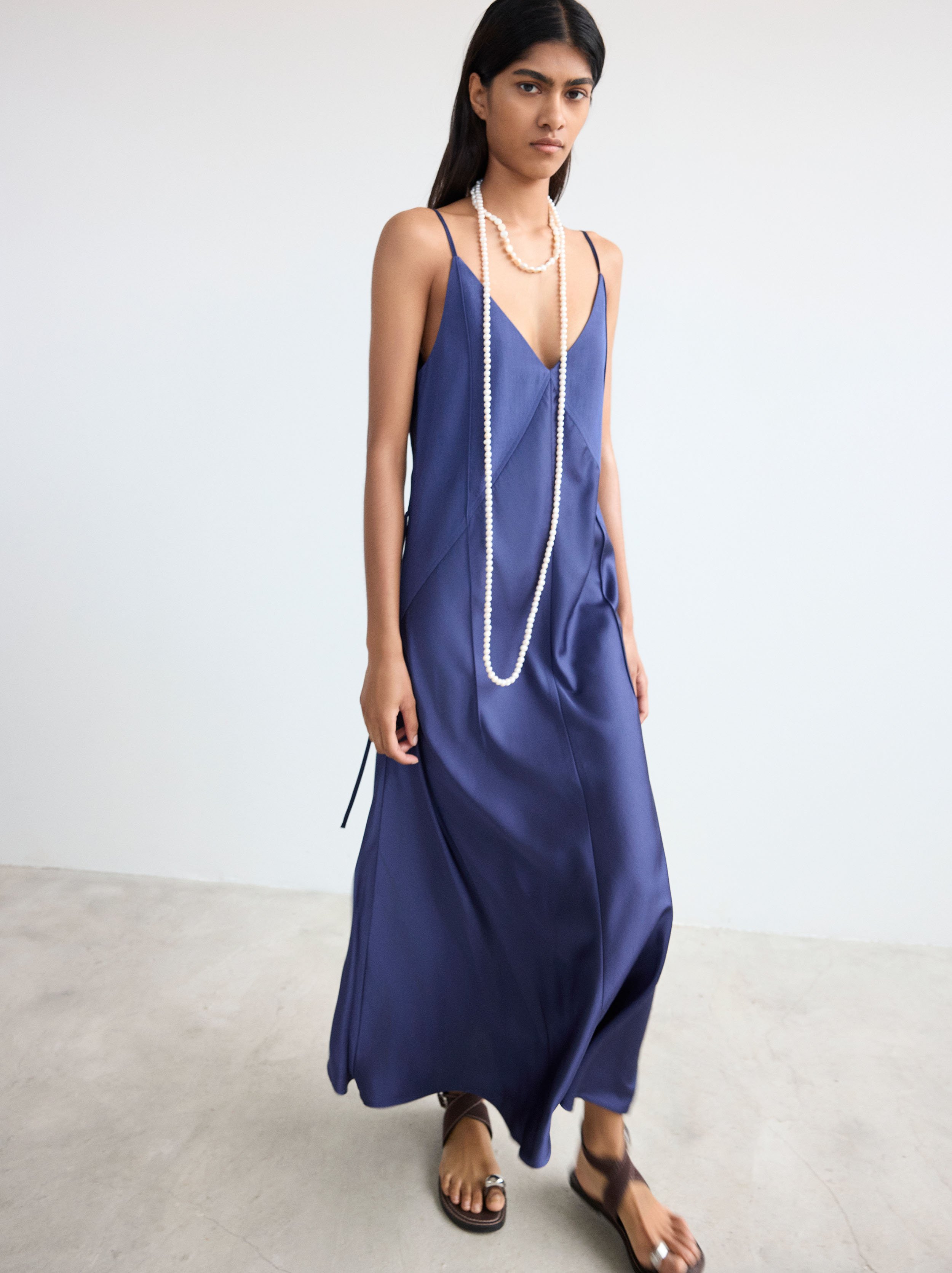 Dress with straps and seams