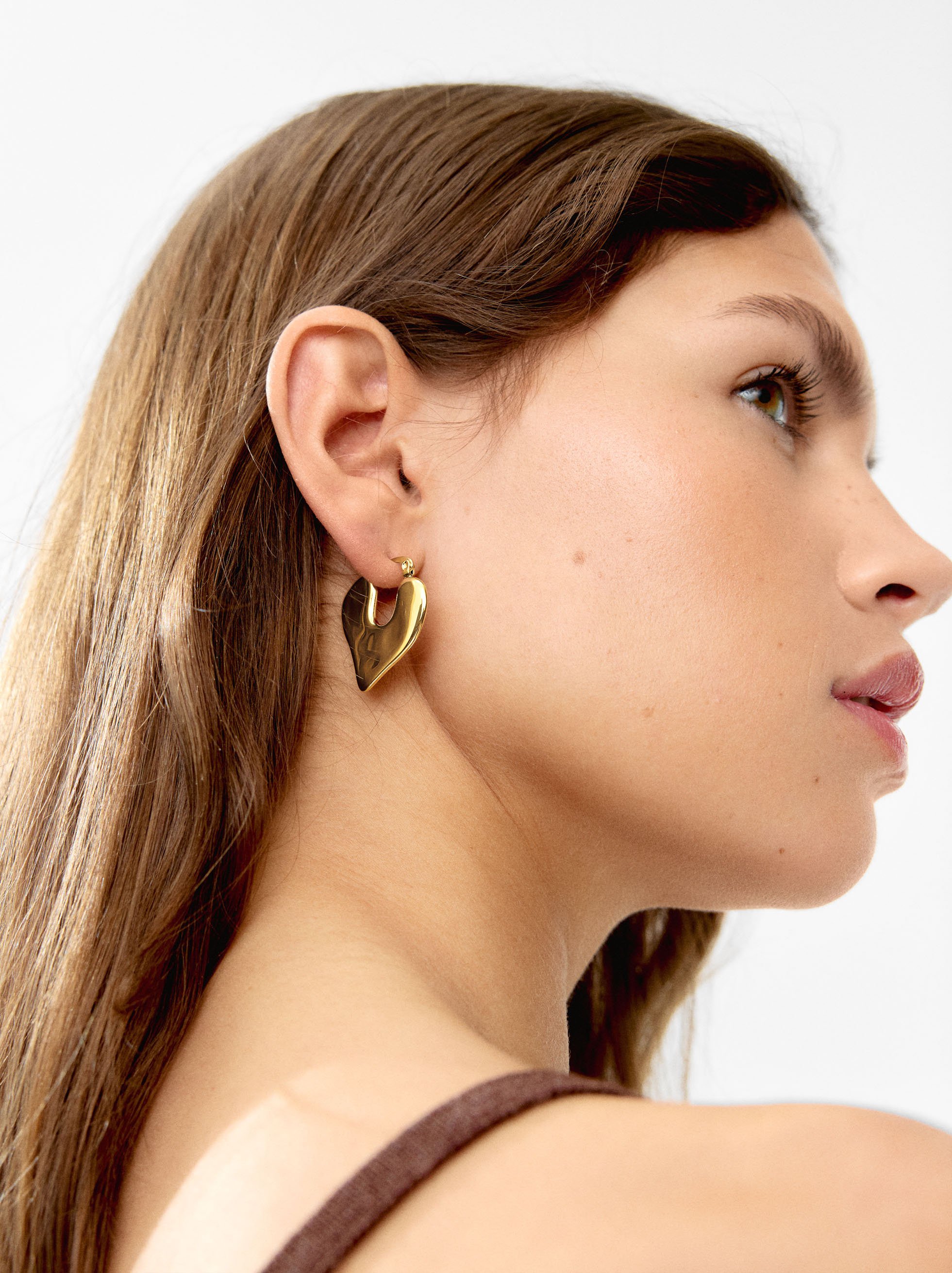 Boucle d'oreille individuelle avec cœur en relief - acier inoxydable