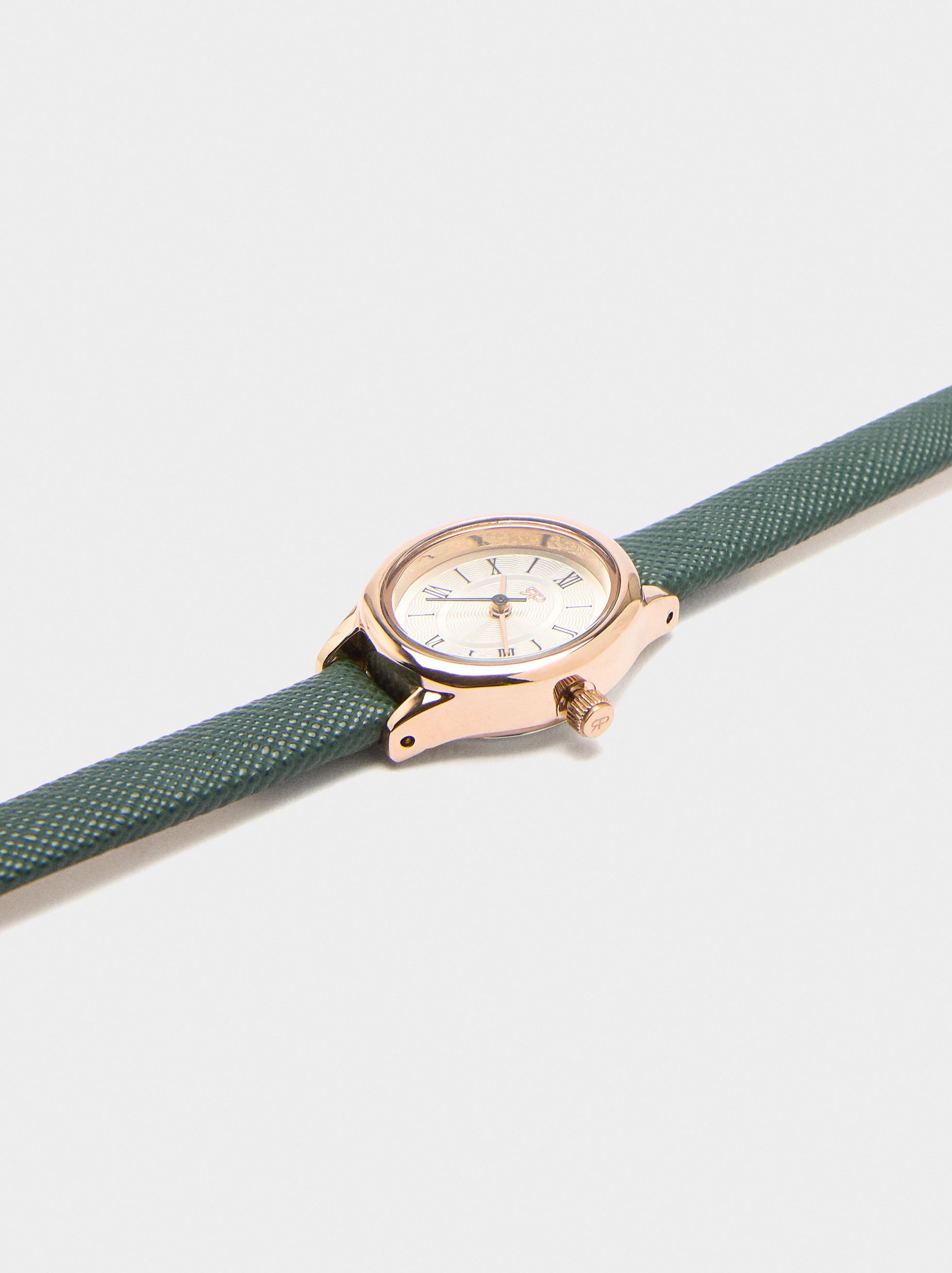 Oval watch with textured strap image number 1.0